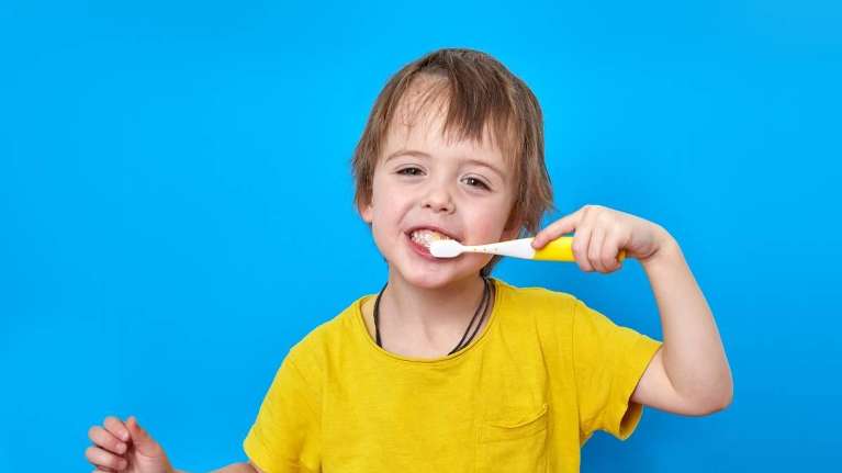 Child brushing teeth