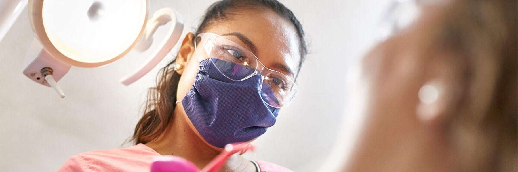 female dentist giving Invisalign treatment